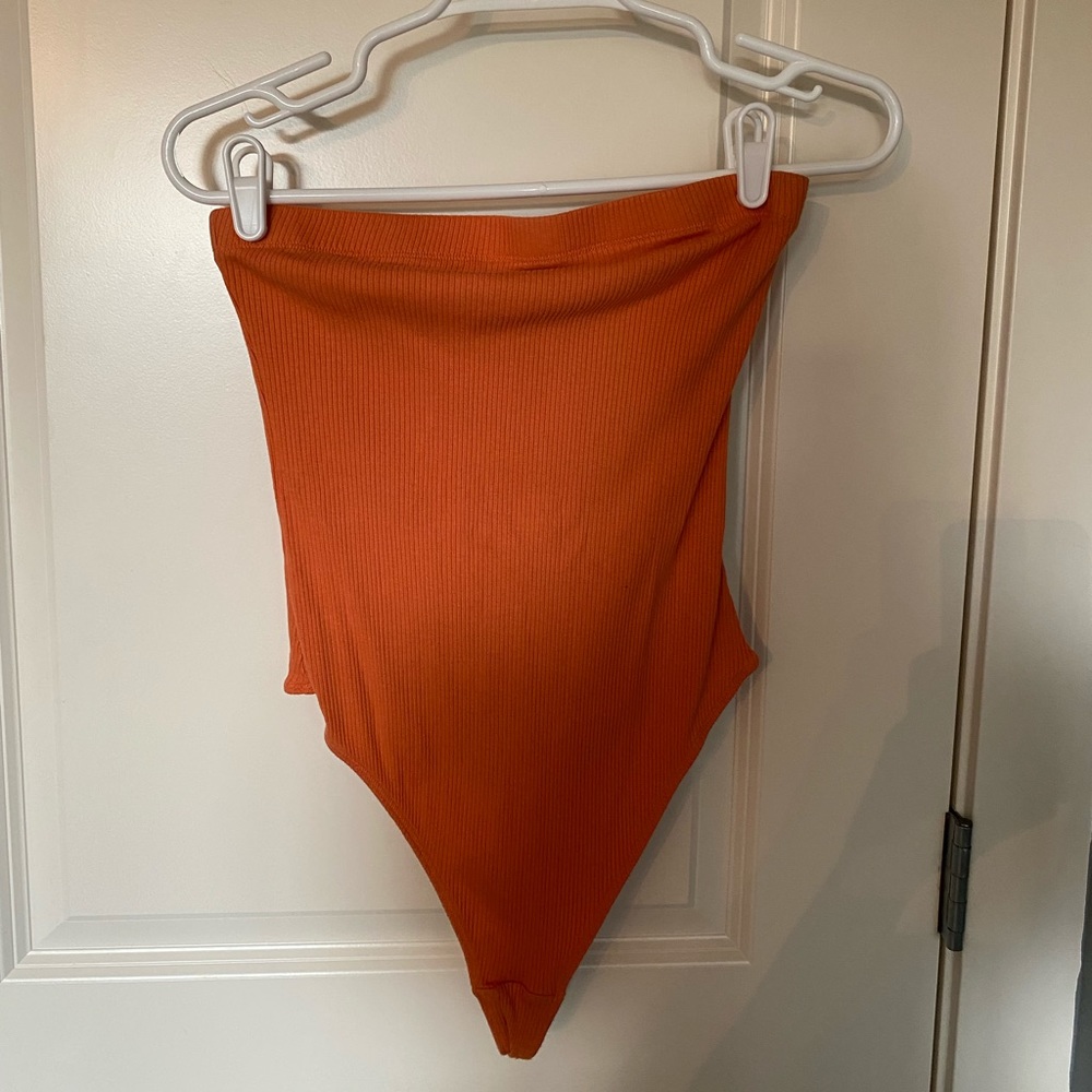 Orange body suit
